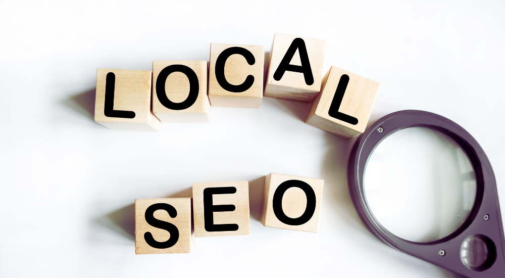 Local business owner checking SEO results on laptop